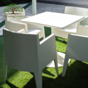 white table on artificial patio turf